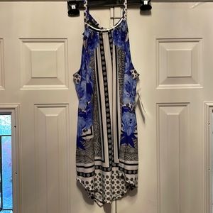 Inc. woman’s blue floral shirt with black and white accents. Spaghetti straps.